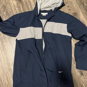 Lined navy blue Nike wind breaker
